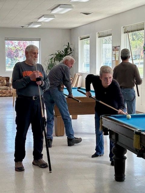 Older adults enjoying pool at Senior Hospitality Center